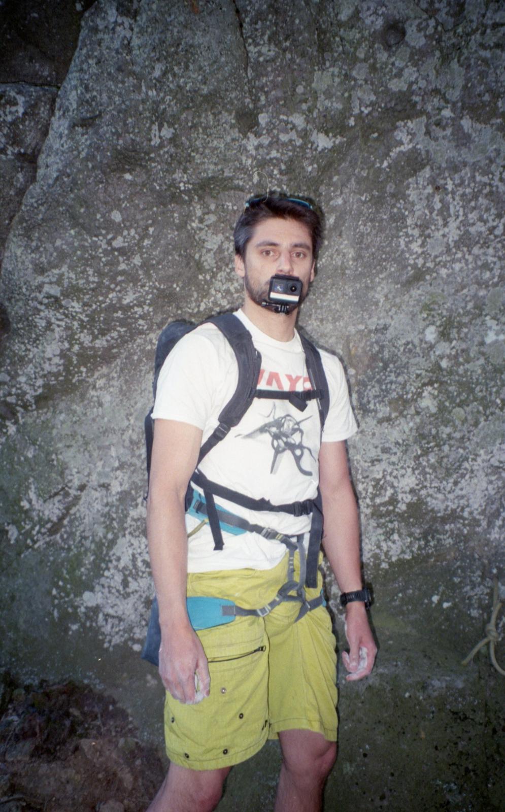 Climber in VAYO gear and harness at a bouldering crag